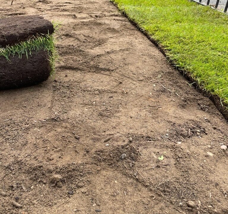 Neglected lawn with patchy brown natural turf and messy artificial turf, highlighting unkempt appearance and increased upkeep costs from lack of turf maintenance.